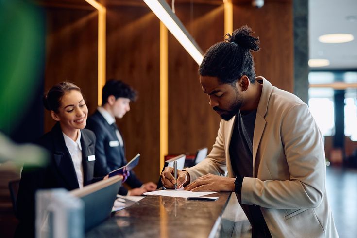 Hospitality team standardizing safety assessments at a hotel front desk