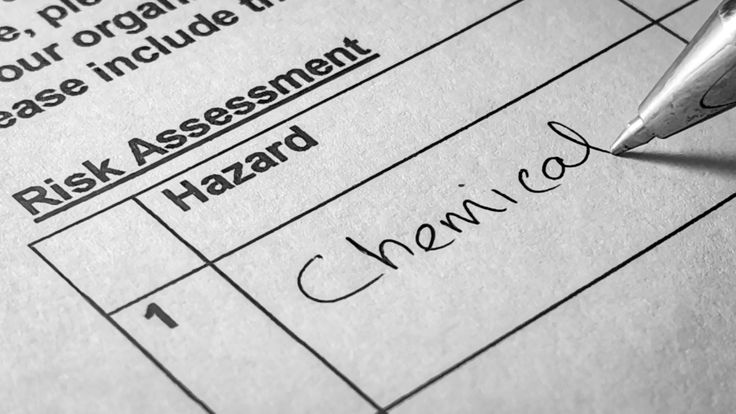 Warehouse team reviewing logistics hazard reports